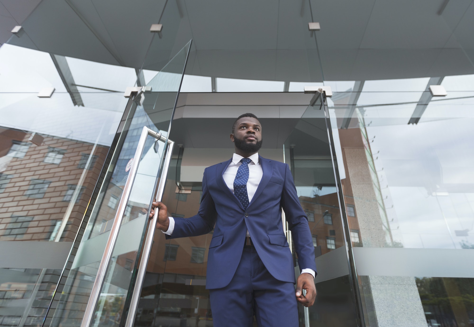 Personal bodyguard monitoring environment before boss will leave the building